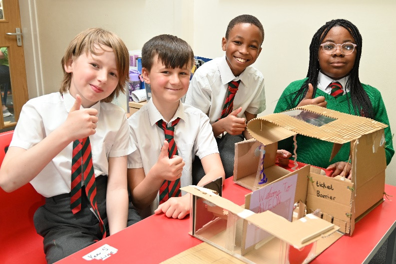 model-building children giving a thumbs up